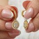 Gümüş Gold Oval Taşlı Sallantılı Küpe Gümüş Gold Oval Taşlı Sallantılı Küpe